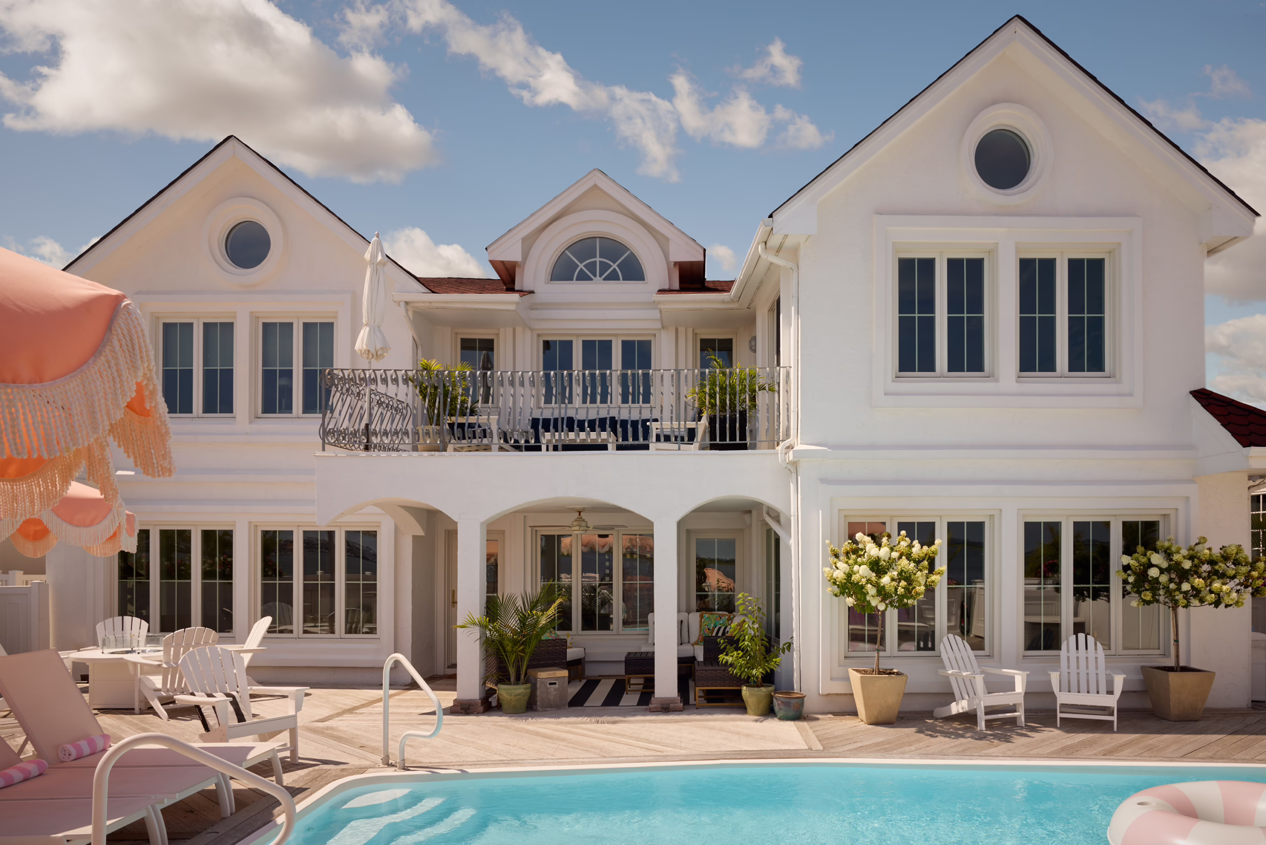 Bayshore waterfront home with a swimming pool and outdoor patio